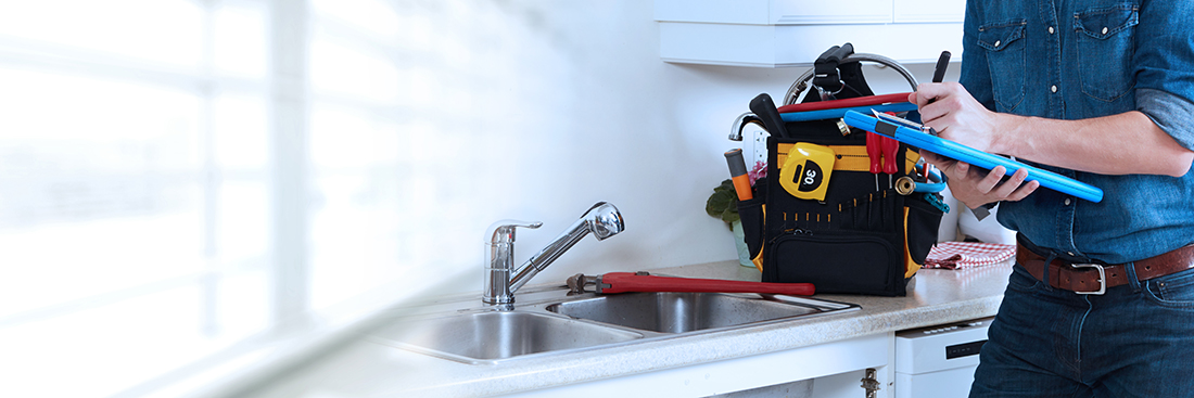 Professional plumber working renovation in kitchen home in Springfield IL